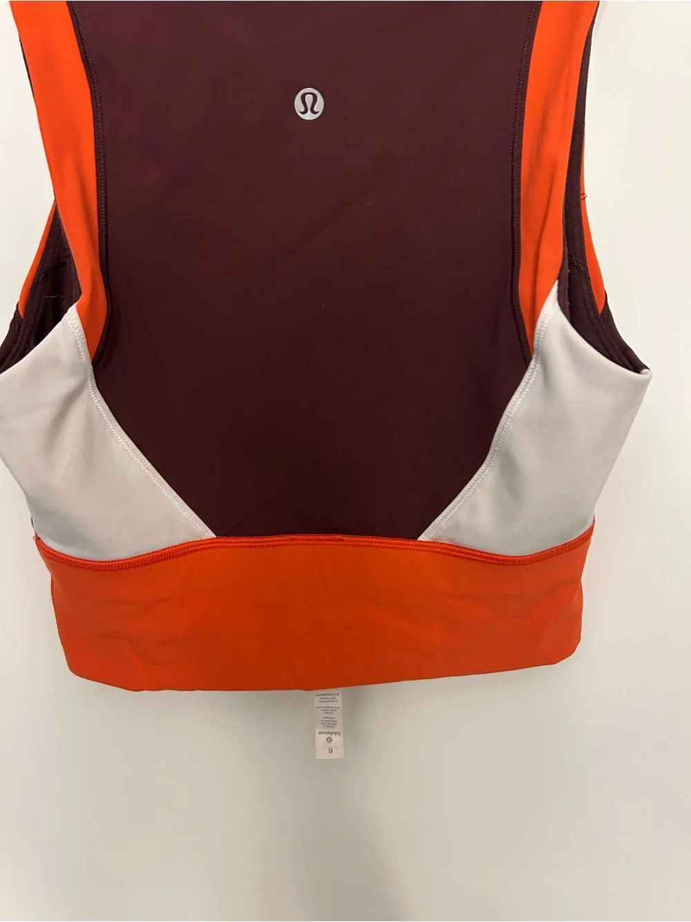 Lululemon Kick Serve Sweat Bra in a tri-color Bordeaux Drama and Orange size 6